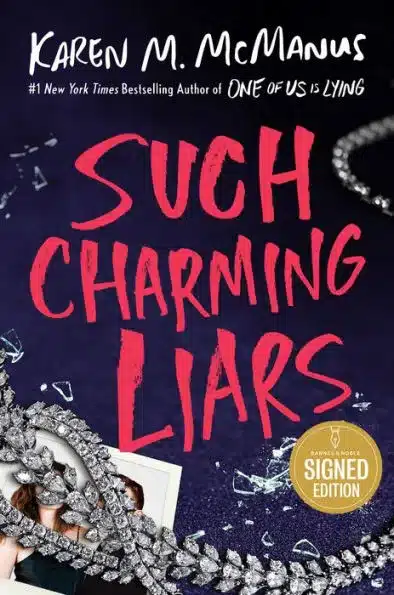 Book cover of a sparkling necklace covering a photograph and large red letters written in marker.
