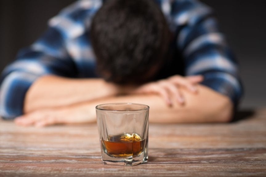 drunk man asleep glass of bourbon passed out sleep
