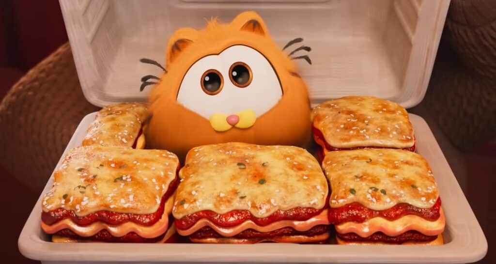 Garfield as a kitten in a box of lasagna