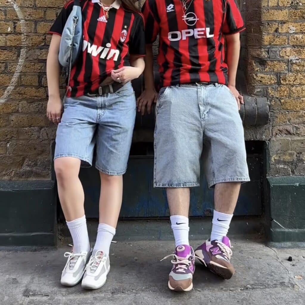 Boy and Girl in Jerseys and Jean Shorts