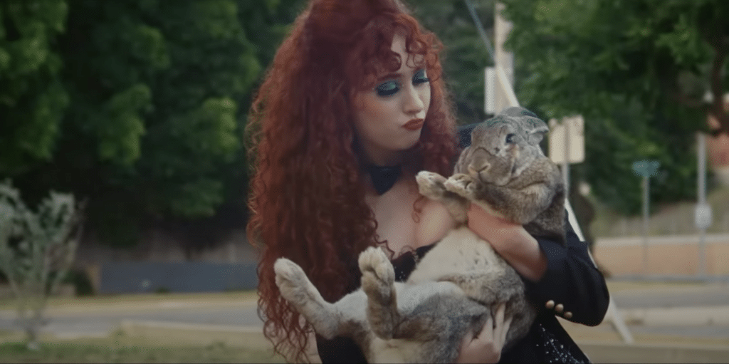 Chappell Roan holds a rabbit in her Red Wine Supernova music video.